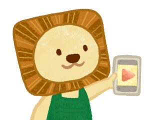 パンフレットに登場するライオンのキャラクターイラスト(スマートフォンを持っているところ)